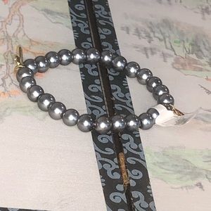 Alexa‘s Angels imitation pearl bracelet with gold tone cross